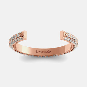 Rose gold bracelet with diamond accents on a white background, branded 'Juwels & Co'.