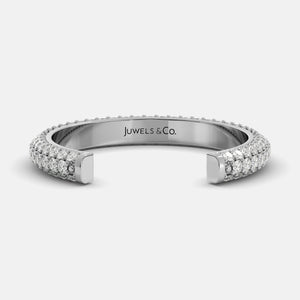 Silver ring with diamond accents on a white background, branded 'Juwels & Co'.