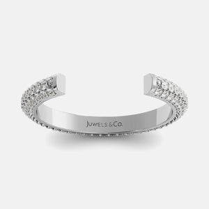 Silver bracelet with gemstones on a white background, branded 'Juwels & Co'.