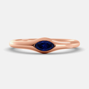 The Crest Wave Ring in 14K rose gold with marquise blue sapphire