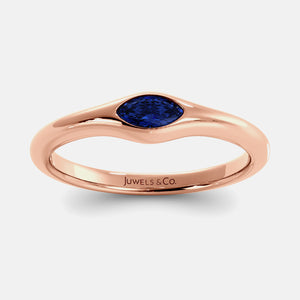 The Crest Wave Ring in 14K rose gold with marquise blue sapphire