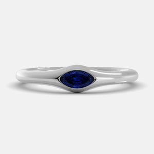 The Crest Wave Ring in 14K white gold with marquise blue sapphire