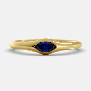 The Crest Wave Ring in 14K yellow gold with marquise blue sapphire