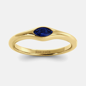 The Crest Wave Ring in 14K yellow gold with marquise blue sapphire