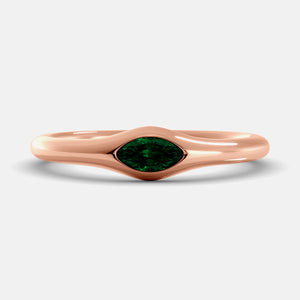 The Crest Wave Ring in 14K rose gold with marquise emerald