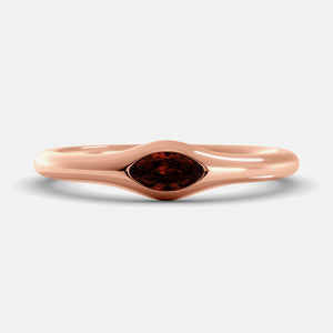 The Crest Wave Ring in 14K rose gold with marquise garnet