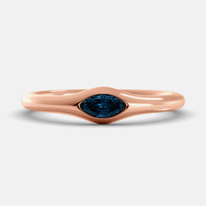 The Crest Wave Ring in 14K rose gold with marquise London blue topaz