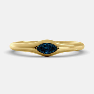 The Crest Wave Ring in 14K yellow gold with marquise London blue topaz
