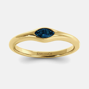 The Crest Wave Ring in 14K yellow gold with marquise London blue topaz