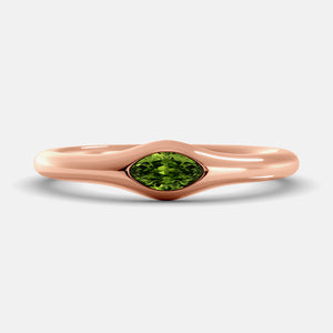 The Crest Wave Ring in 14K rose gold with marquise peridot