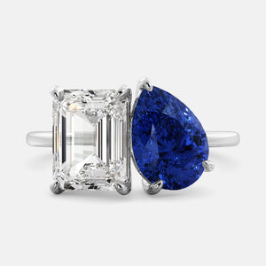 Toi et Moi ring with an emerald-cut Diamond and a pear-cut Blue Sapphire.