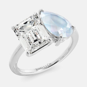Toi et Moi ring with an emerald-cut Diamond and a pear-cut Moonstone.