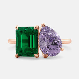Toi et Moi ring with an emerald-cut Emerald and a pear-cut Amethyst.