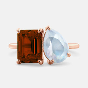 Toi et Moi ring with an emerald-cut Garnet and a pear-cut Moonstone.