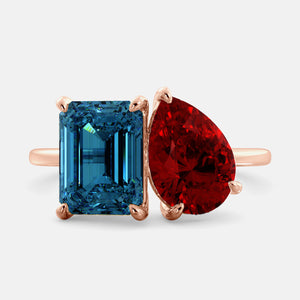 Toi et Moi ring with an emerald-cut London Blue Topaz and a pear-cut Ruby.