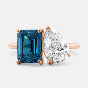 Toi et Moi ring with an emerald-cut London Blue Topaz and a pear-cut Diamond.