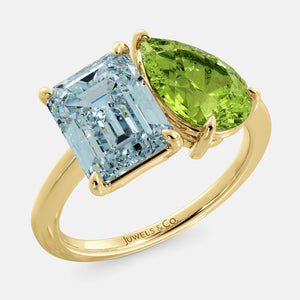 Toi et Moi ring with an emerald-cut Sky Blue Topaz and a pear-cut Green Peridot.