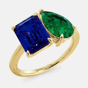 Toi et Moi ring with an emerald-cut Blue Sapphire and a pear-cut Emerald.