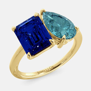 Toi et Moi ring with an emerald-cut Blue Sapphire and a pear-cut London Blue Topaz.
