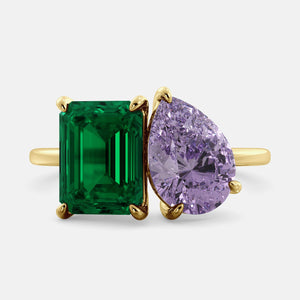 Toi et Moi ring with an emerald-cut Emerald and a pear-cut Amethyst.