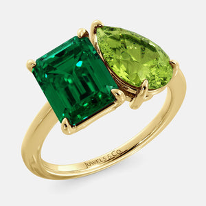 Toi et Moi ring with an emerald-cut Emerald and a pear-cut Green Peridot.