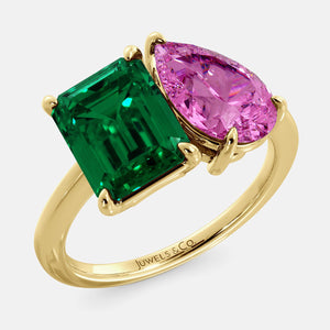 Toi et Moi ring with an emerald-cut Emerald and a pear-cut Pink Sapphire.