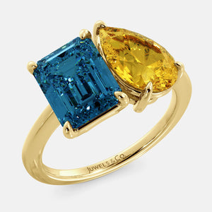 Toi et Moi ring with an emerald-cut London Blue Topaz and a pear-cut Citrine.