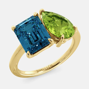 Toi et Moi ring with an emerald-cut London Blue Topaz and a pear-cut Green Peridot.