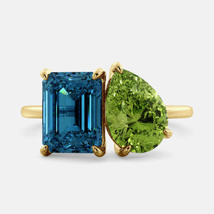Toi et Moi ring with an emerald-cut London Blue Topaz and a pear-cut Green Peridot.