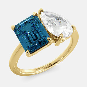 Toi et Moi ring with an emerald-cut London Blue Topaz and a pear-cut Diamond.
