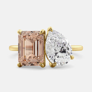 Toi et Moi ring with an emerald-cut Morganite and a pear-cut White Topaz.