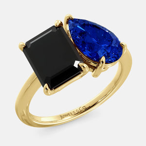 Toi et Moi ring with an emerald-cut Onyx and a pear-cut Blue Sapphire.