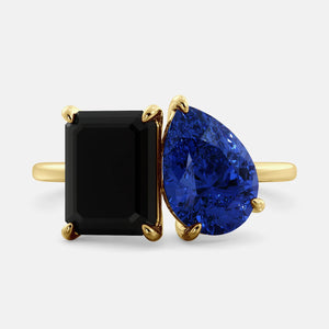 Toi et Moi ring with an emerald-cut Onyx and a pear-cut Blue Sapphire.