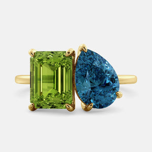 Toi et Moi ring with an emerald-cut Green Peridot and a pear-cut London Blue Topaz.