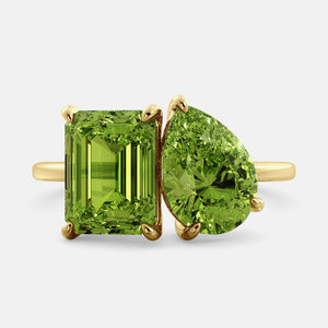 Toi et Moi ring with an emerald-cut Green Peridot and a pear-cut Green Peridot.
