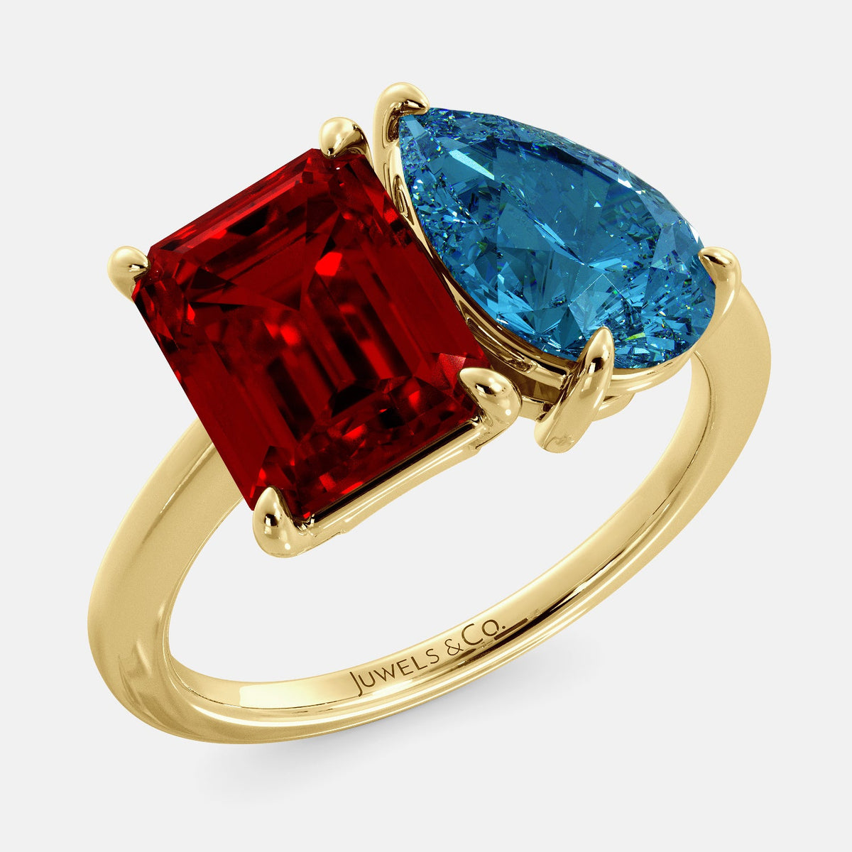 A toi et moi ring with an emerald-cut ruby and a pear-cut gemstone. The emerald-cut morganite is set on the left of the ring, and the pear-cut gemstone is set on the right. The ring is made of recycled yellow gold and has a simple, elegant design. The pear-cut gemstone can be customized. **Here are some additional details about the image:** * The emerald-cut white ruby is a birthstone for July. * The pear-cut gemstone can be customized to any stone of your choice.