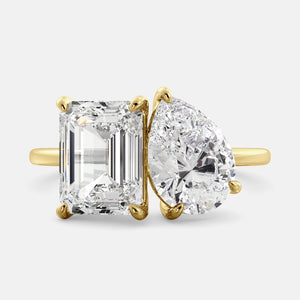 Toi et Moi ring with an emerald-cut Diamond and a pear-cut Diamond.