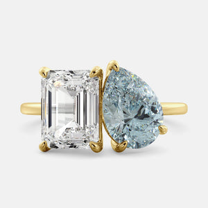 Toi et Moi ring with an emerald-cut Diamond and a pear-cut Aquamarine.