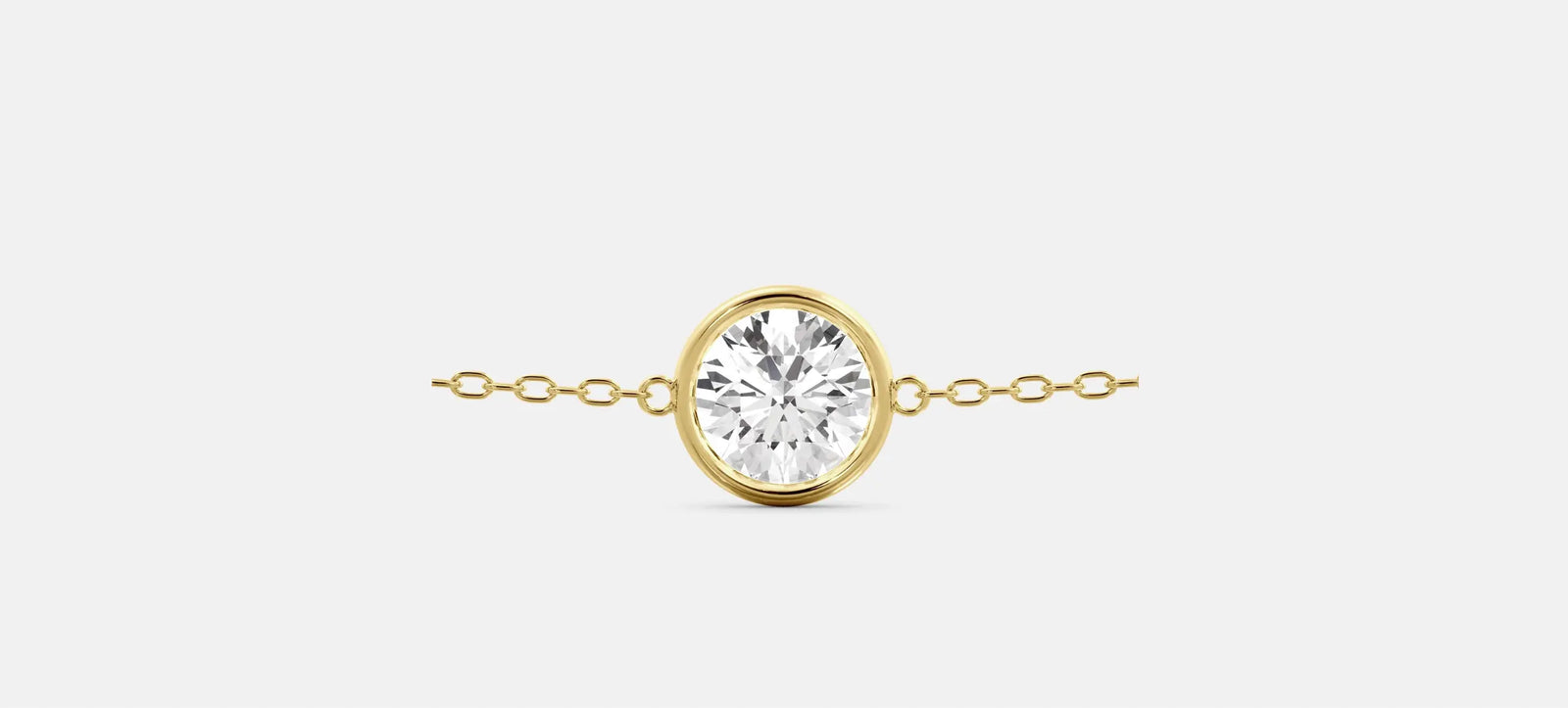 half bezel bracelet in yellow gold on a grey background