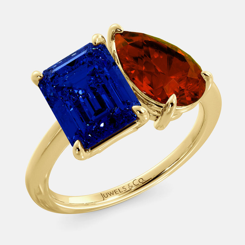 Toi et Moi ring with an emerald-cut Blue Sapphire and a pear-cut Garnet.