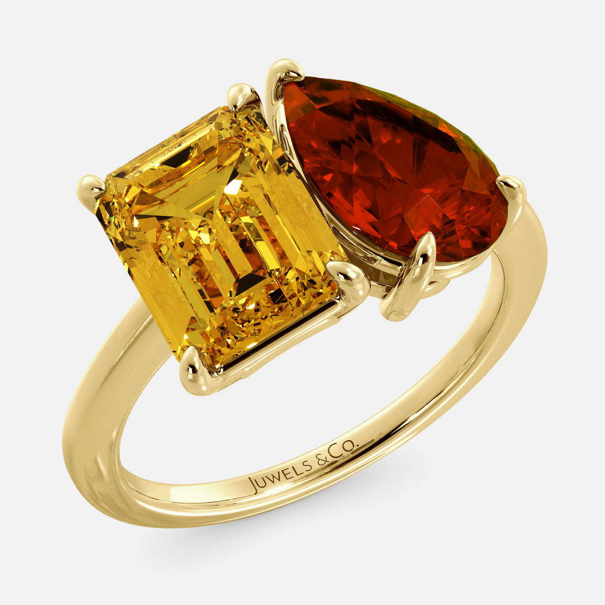 A toi et moi ring with an emerald-cut Citrin and pear-cut gemstone. The emerald-cut morganite is set on the left of the ring, and the pear-cut gemstone is set on the right. The ring is made of recycled yellow gold and has a simple, elegant design. The pear-cut gemstone can be customized. **Here are some additional details about the image:** * The emerald-cut white Citrin is a birthstone for November. * The pear-cut gemstone can be customized to any stone of your choice.