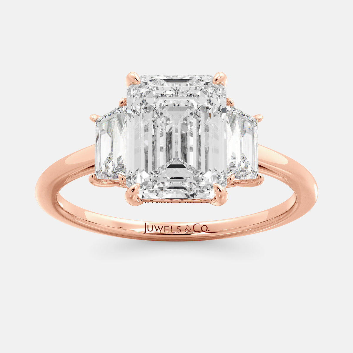 Embrace Opulence: The Julia Emerald Solitaire Diamond Ring with Tapered Baguettes