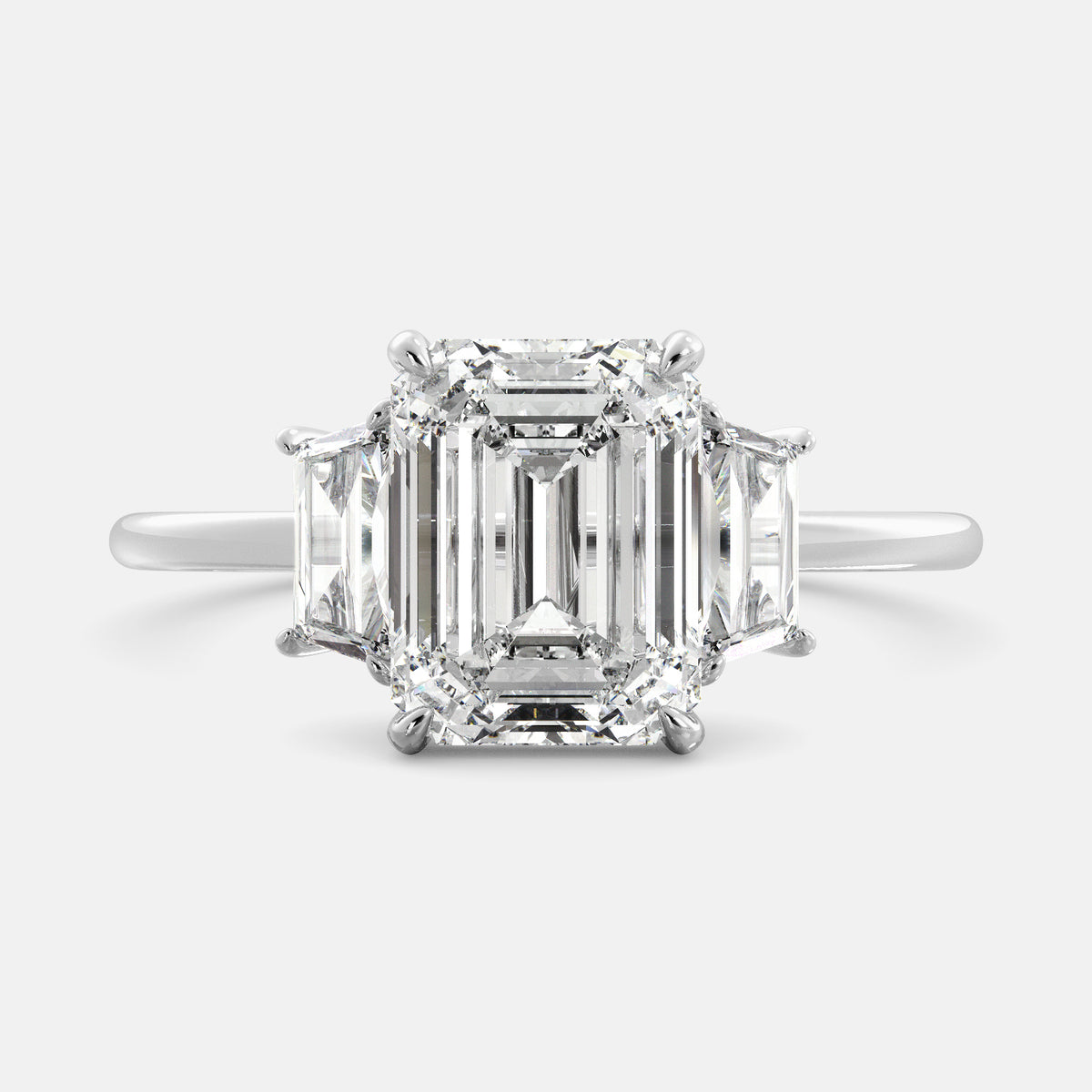 Embrace Opulence: The Julia Emerald Solitaire Diamond Ring with Tapered Baguettes