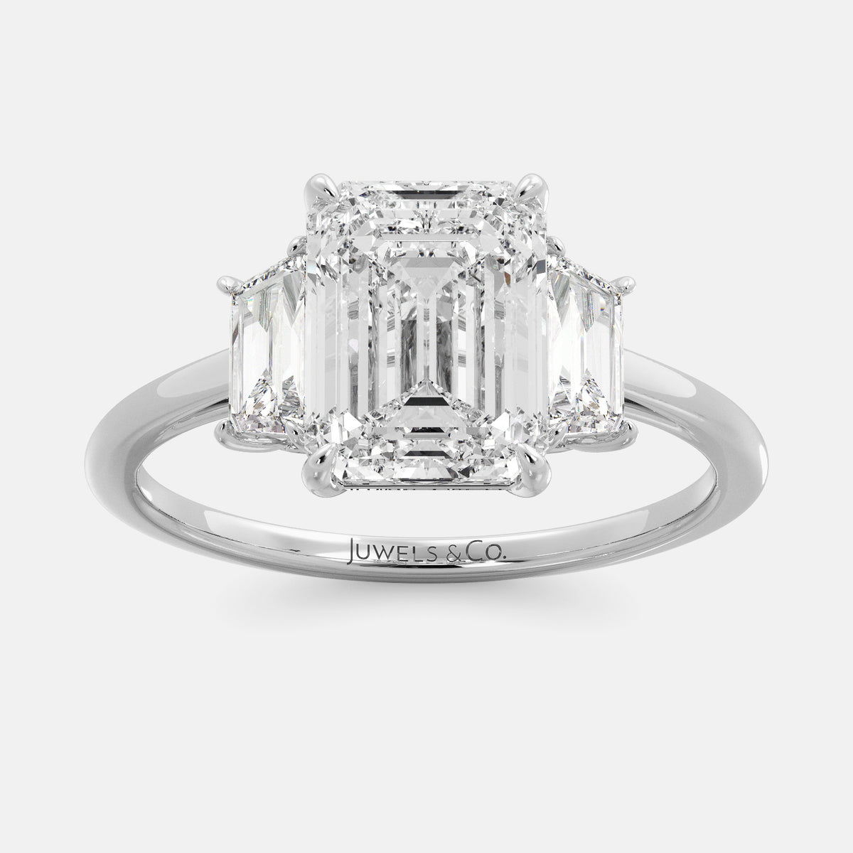 Embrace Opulence: The Julia Emerald Solitaire Diamond Ring with Tapered Baguettes