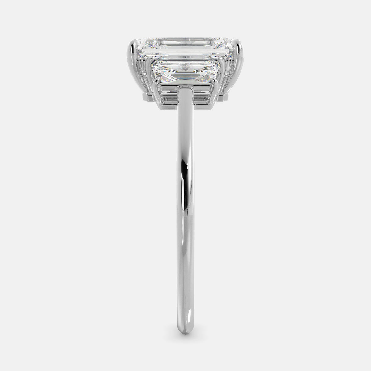 Embrace Opulence: The Julia Emerald Solitaire Diamond Ring with Tapered Baguettes