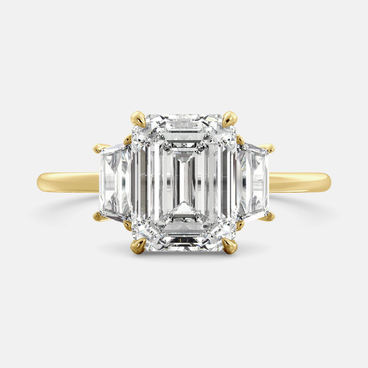 Embrace Opulence: The Julia Emerald Solitaire Diamond Ring with Tapered Baguettes