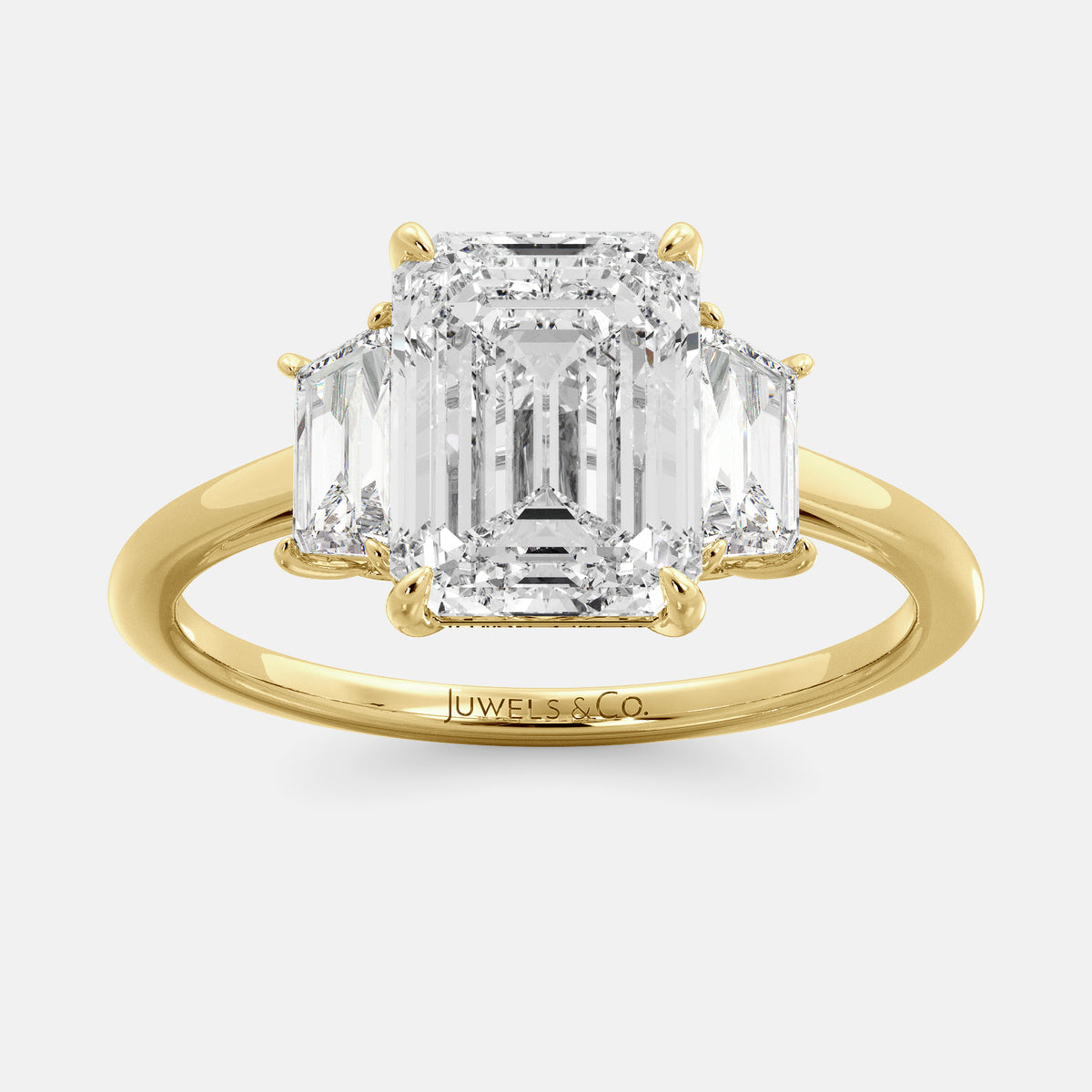 Embrace Opulence: The Julia Emerald Solitaire Diamond Ring with Tapered Baguettes
