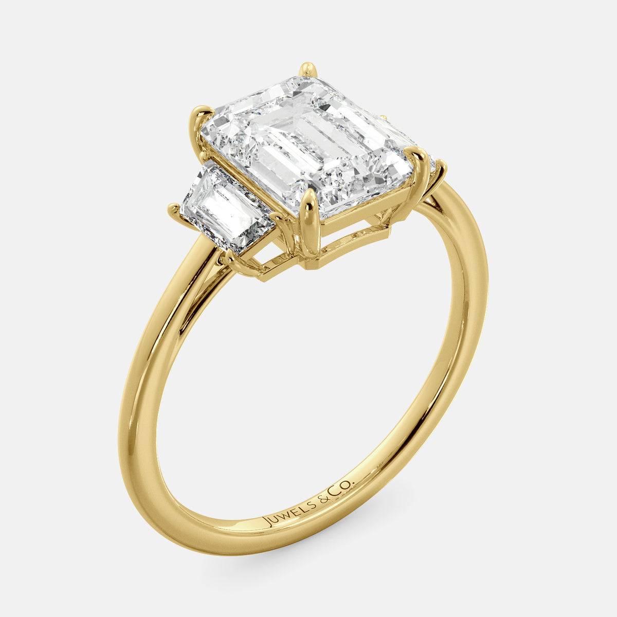Embrace Opulence: The Julia Emerald Solitaire Diamond Ring with Tapered Baguettes