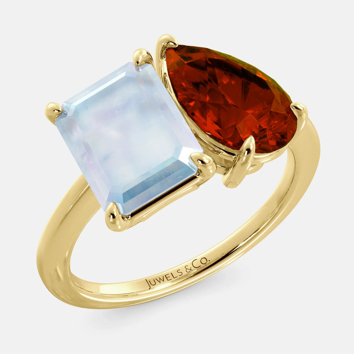 A toi et moi ring with an emerald-cut moonstone and a pear-cut gemstone. The emerald-cut morganite is set on the left of the ring, and the pear-cut gemstone is set on the right. The ring is made of recycled yellow gold and has a simple, elegant design. The pear-cut gemstone can be customized. **Here are some additional details about the image:** * The emerald-cut white moonstone is a birthstone for June. * The pear-cut gemstone can be customized to any stone of your choice.