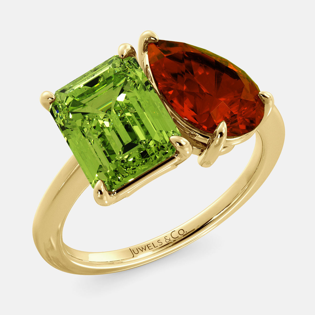 A toi et moi ring with an emerald-cut Green Peridot and a pear-cut gemstone. The emerald-cut morganite is set on the left of the ring, and the pear-cut gemstone is set on the right. The ring is made of recycled yellow gold and has a simple, elegant design. The pear-cut gemstone can be customized. **Here are some additional details about the image:** * The emerald-cut white Green Peridot is a birthstone for August. * The pear-cut gemstone can be customized to any stone of your choice.